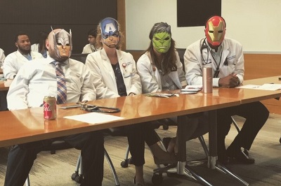 Residents wear super hero masks to lighten the mood.jpg